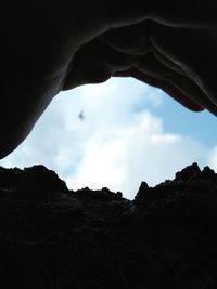 Low angle view of rock formation against sky