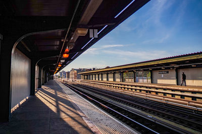 Railroad station platform against sky