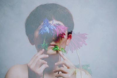 Close-up of woman holding flowers