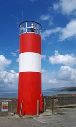 Red lighthouse against blue sky