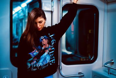 Close-up of woman looking through train window