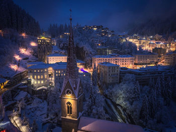 Illuminated buildings in city at night