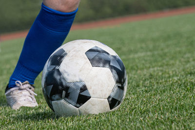 Close-up of soccer ball on field