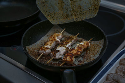 High angle view of meat in cooking pan