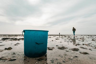 Man on beach against sky