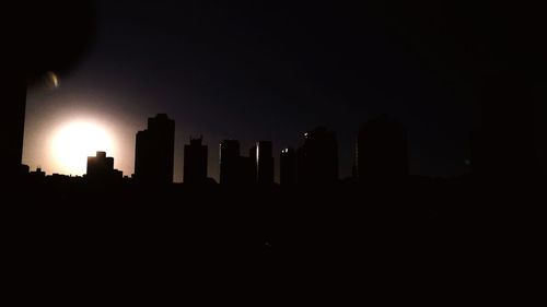 Silhouette of skyscrapers at night