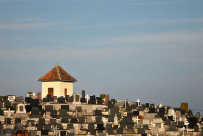 Buildings in city against sky