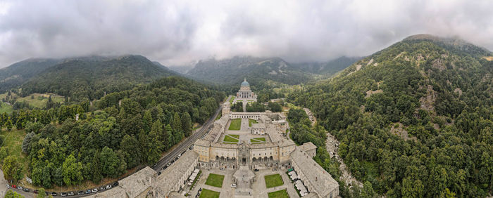 High angle view of trees and mountains against sky