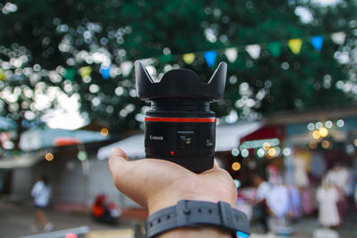 Close-up of person photographing camera on mobile phone