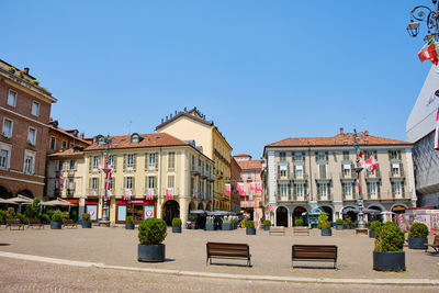 People in front of buildings