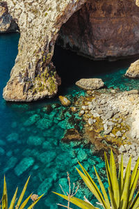 High angle view of rock formation by sea