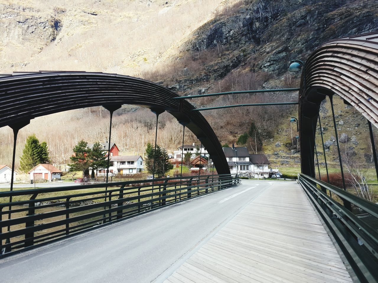 transportation, connection, bridge - man made structure, arch, architecture, built structure, road, on the move, the way forward, mode of transport, bridge, engineering, city, day, elevated road, outdoors, tunnel, overpass, city life, passing, power line, modern