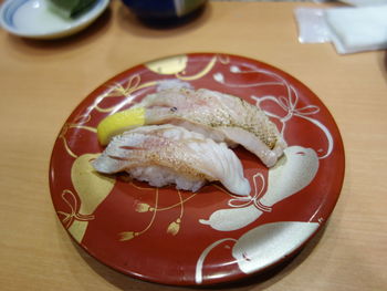 Close-up of fish in plate on table