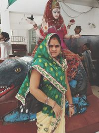 Portrait of happy woman in traditional clothing