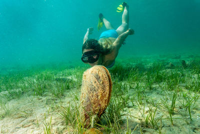 Boy swimming in sea