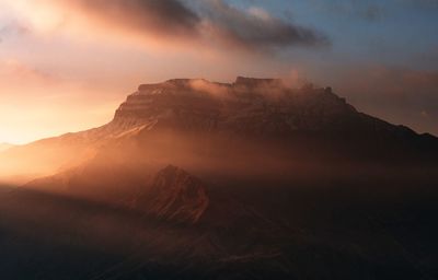 Low angle view of rocky mountain against sky