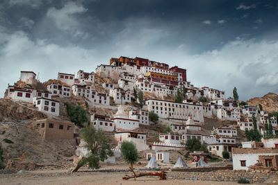 Buildings in town against sky