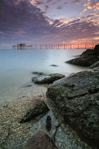 Scenic view of sea against sky at sunset