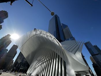 Low angle view of modern building against clear blue sky - new york