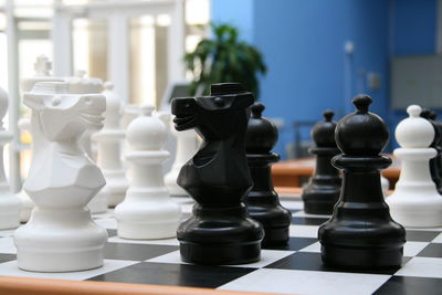 Close-up of chess pieces on board