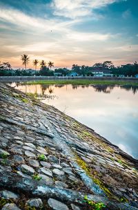 Scenic view of lake against sky during sunset