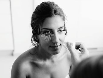 Portrait of young woman at home