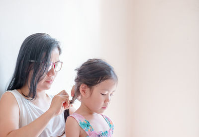 Mother and girl at home