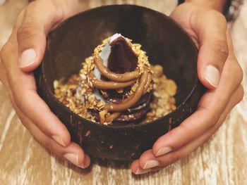 Midsection of person holding ice cream