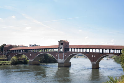 Bridge over river against sky