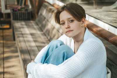 Portrait of young woman looking away