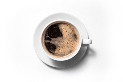 High angle view of coffee cup over white background