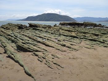 This is a famous tourist spot for its green stones and has a fairly fine sand.