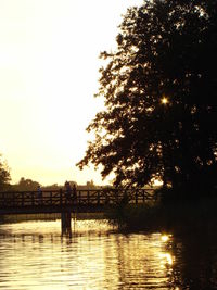 Scenic view of river at sunset