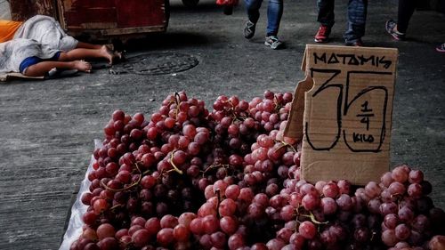 Low section of woman for sale at market stall