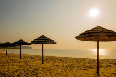 Scenic view of beach against sky during sunset