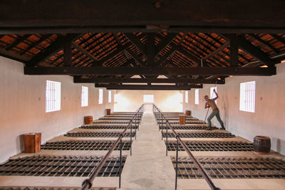 Low angle view of man walking in building