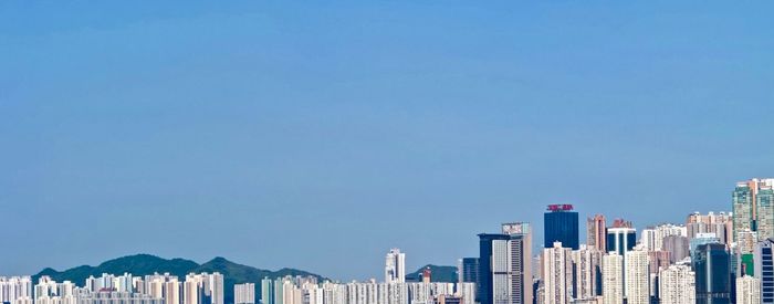 Low angle view of buildings against blue sky