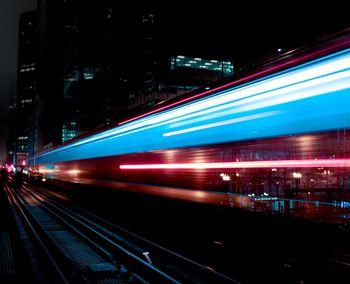 Light trails on railroad tracks at night