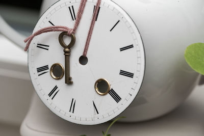 Close-up of clock on wall