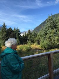 Woman looking at mountain landscape