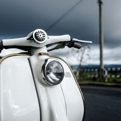 Close-up of vintage car against sky