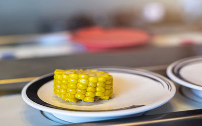 Close-up of fresh fruits in plate on table