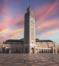 View of historical building of hassan ii mosque against sky during sunset - casablanca, morocco
