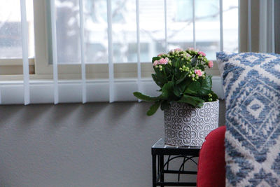 Flower vase on table at home