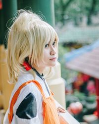 Close-up of girl standing outdoors