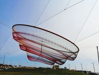 Low angle view of umbrella against clear sky