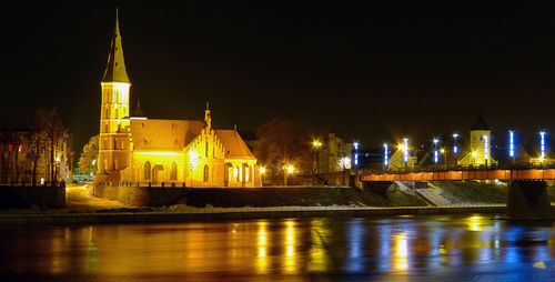 Illuminated buildings in city at night