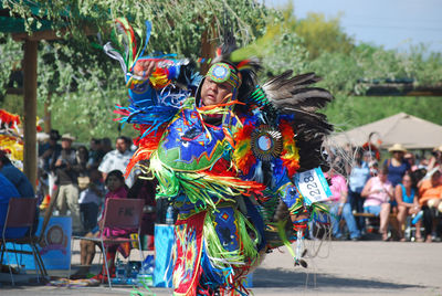 Person in costume dancing on road