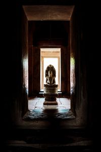 Buddha statue in old building