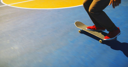 Low section of man walking on floor